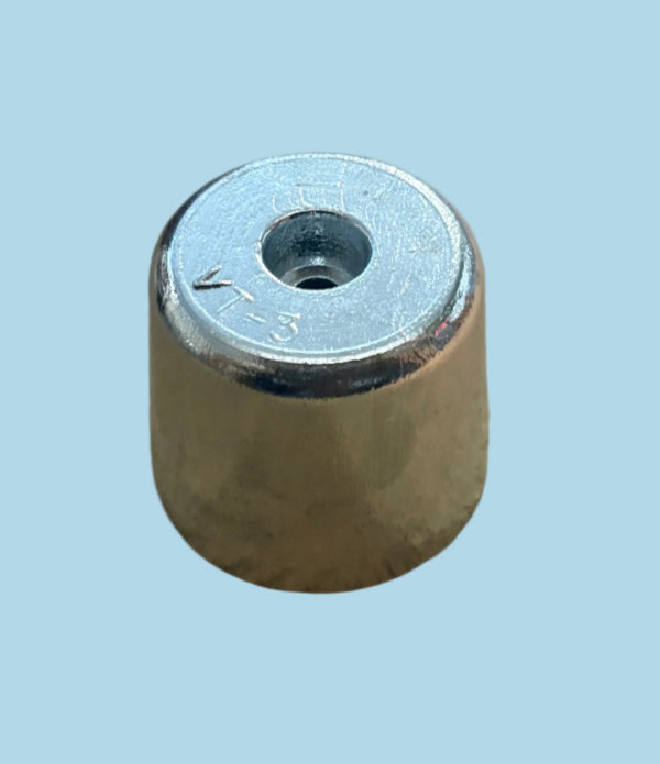 Metallic cylindrical object with a threaded hole on a light blue background